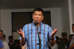 President Rodrigo Roa Duterte announces that while he could order an all-out offensive against the Abu Sayaff, he is more concerned about putting an end to the violence as it also affects the lives of the civilians in his speech during his visit at Camp General Basilio Navarro in Zamboanga City on November 25, 2016. ALBERT ALCAIN/Presidential Photo