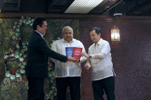 Presidential Communications Secretary Martin Andanar and Executive Secretary Salvador Medialdea hand over the Freedom of Information (FOI) Manuals to Alliance of Concerned Teachers Representative Antonio Tinio during a ceremony at the Heroes Hall in Malacañan on November 25, 2016. ALFRED FRIAS/Presidential Photo