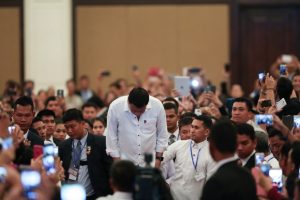President Rodrigo Roa Duterte bows before a crowd of supporters as he visited the Filipino community in Cambodia at the Sofitel Phnom Penh Phokeethra Hotel on December 13, 2016. TOTO LOZANO/Presidential Photo