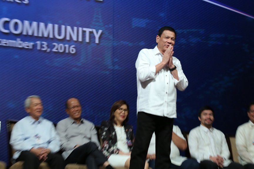 President Rodrigo Roa Duterte does the 'sampeah' or the traditional Cambodian greeting to the crowd during the meeting with the Filipino community in Cambodia at Sofitel Phnom Penh Phokeethra Hotel on December 13, 2016. KING RODRIGUEZ/Presidential Photo