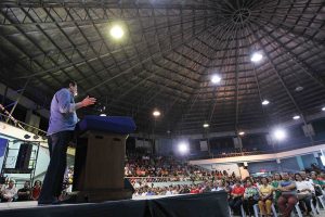 President Rodrigo Roa Duterte delivers a message while leading the gift-giving to the barangay officials in Davao City at the Almendras Gym Davao City Recreation Center on December 27, 2016. ACE MORANDANTE/Presidential Photo