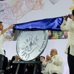 President Rodrigo Roa Duterte and Bangko Sentral ng Pilipinas (BSP) Governor Amando Tetangco Jr. unveil the commemorative coin for the Philippines' Association of Southeast Asian Nations (ASEAN) chairmanship for 2017 during a ceremony at the SMX Convention Center in Davao City on January 15, 2017. RENE LUMAWAG/Presidential Photo