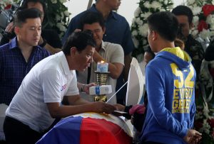 President Rodrigo Duterte condoles with the family of slain Cpl. Michale Yadao at Eastern Mindanao Command headquarters in Davao City on Friday. Yamado and Pvt. Virnin Damondon were killed in an encounter with New People’s Army (NPA) rebels in Barangay Lacson in Davao City last February 16. Newsline Photo