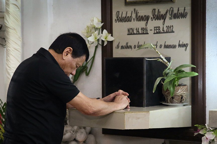 President Rodrigo Roa Duterte spends a solemn moment at the grave of his mother Soledad 'Nanay Soling' Duterte at the Davao Catholic Cemetery to commemorate her death anniversary on February 4, 2017. KARL NORMAN ALONZO/ Presidential Photo