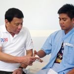 President Rodrigo Duterte examines the injuries of Corporal Abelardo Suela Jr., one of the soldiers wounded in an encounter with the New People’s Army at Brgy. Lamanan in Calinan District, Davao City on February 16, 2017. The President personally visited the wounded soldiers at Camp Panacan Station Hospital in Davao City on February 17, 2017 to award them with Wounded Personnel Medals as well as cash assistances. PCOO Davao