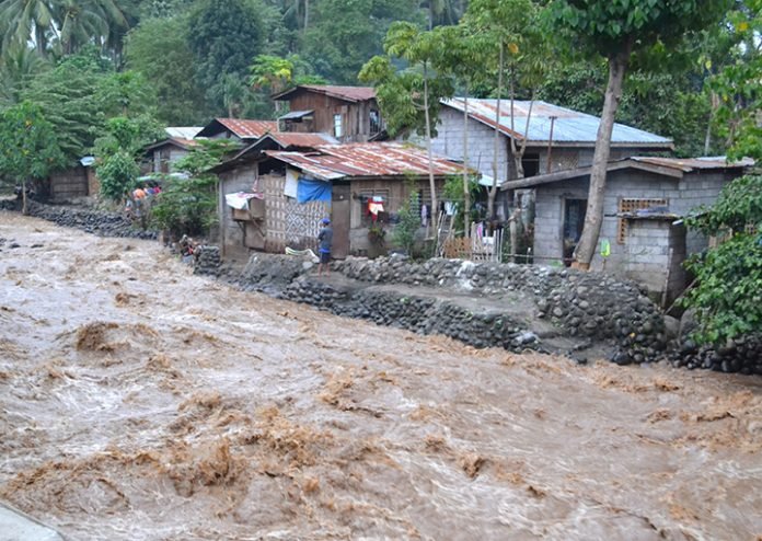 Photo by Henrylito D. Tacio Flash flood in rural area. Photo by Henrylito D. Tacio
