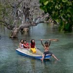 HIDDEN GETAWAY. Local tourists enjoy the crystal clear water under the shades of century-old mangrove trees of Bong Feo resort in Barangay Lago, Glan, Sarangani province during the weekend. Just a 30-minute ride from General Santos City, this mangrove surrounded resort is a perfect getaway for family and backpackers. (Cocoy Sexcion for SARANGANI INFORMATION OFFICE)