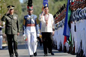 President Rodrigo Roa Duterte is joined by Philippine Military Academy (PMA) Superintendent Lt. Gen. Donato San Juan II as he walks past honor guards upon his arrival at Fort General Gregorio H. del Pilar in Baguio City on March 12, 2017 for the PMA 'Salaknib' Class of 2017 Commencement Exercises. RICHARD MADELO/Presidential Photo