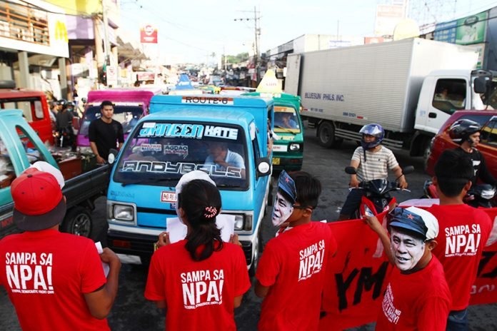 Supporters of the communist movement hold a lightning rally at Bankerohan, Davao City on Wednesday, March 29, commemorating the 48th Anniversary of the New People’s Army, the armed wing of the Communist Party of the Philippines. Newsline Photo