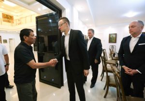 President Rodrigo Roa Duterte welcomes Hungary Minister of Foreign Affairs Péter Szijjártó to the Presidential Guest House in Davao City on March 27, 2017. ACE MORANDANTE/Presidential Photo