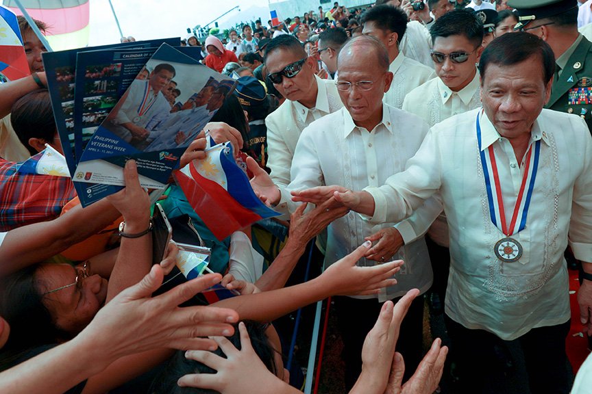 President Rodrigo Roa Duterte interacts with the attendees of the 75th Commemoration of the Araw ng Kagitingan and Veterans Week at the Dambana ng Kagitingan in Bataan on April 9, 2017. Also in the photo is Defense Secretary Delfin Lorenzana. TOTO LOZANO/Presidential Photo