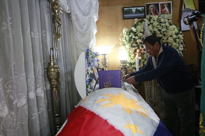 Right after President Rodrigo Roa Duterte's arrival from a successful visit to three countries in the Middle East, he goes straight to the wake of the late 2Lt. Estilito Saldua, Jr. in San Jose, Batangas on April 17, 2017. Here the President awards a posthumous medal to Saldua who was killed while thwarting the terror attack of the Abu Sayyaf Group in Bohol recently. REY BANIQUET/Presidential Photo