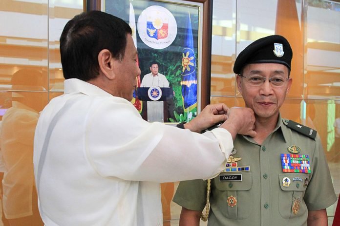 President Rodrigo Roa Duterte leads the donning of rank to newly-installed Presidential Security Group (PSG) Commander Colonel Lope Dagoy during a ceremony at the at the Villamor Air Base in Pasay City on April 8, 2017. ACE MORANDANTE/Presidential Photo
