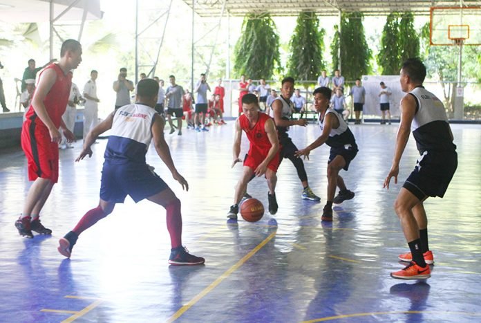 Filipino and Chinese sailors play basketball inside the Naval Forces Eastern Mindanao headquarters in Panacan, Davao City on Monday. Filipino sailors defeated the visitors 68-64. The sailors are crew members of the three Chinese warships, which was in the city from April 30 to May 2 for a goodwill visit. Newsline Photo