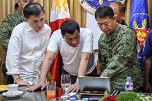 President Rodrigo Roa Duterte views the presentation being showed by Armed Forces of the Philippines chief of staff Gen. Eduardo Año related to the current developments on the terror crisis in Marawi City during a meeting in Davao City on May 29, 2017. With them is Special Assistant to the President, Christopher Bong Go. PRESIDENTIAL PHOTO