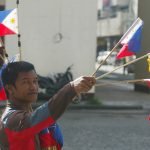 A vendor sells miniature flags along the street in Davao City in time of the 119th Independence Day celebration on Monday, June 12. Newsline Photo