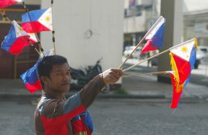 A vendor sells miniature flags along the street in Davao City in time of the 119th Independence Day celebration on Monday, June 12. Newsline Photo