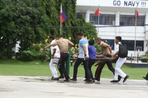 RUSHING: A PSG personnel brought to Camp Panacan Hospital after the New People's Army rebels ambushed their convoy along the Davao-Botabato-Bukidnon highway Wednesday morning. Newsline Photo
