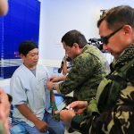 President Rodrigo Roa Duterte awards a wounded personnel medal to Staff Sergeant Gerry Torsal during the President's visit to Camp Panacan Station Hospital in Davao City on July 20, 2017. Torsal was one of the Presidential Security Group (PSG) personnel wounded in an encounter against the New People's Army in Arakan, North Cotabato on July 19. ALBERT ALCAIN/PRESIDENTIAL PHOTO