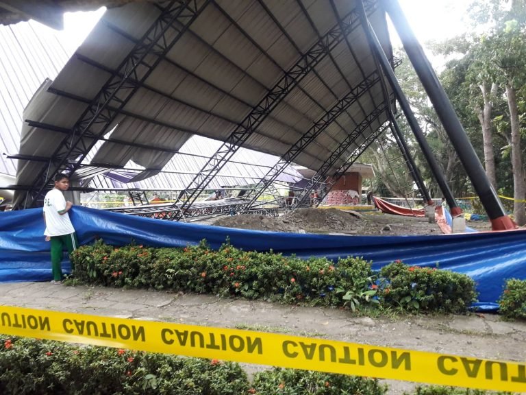 School gym collapsed with two workers on top minutes after the recess