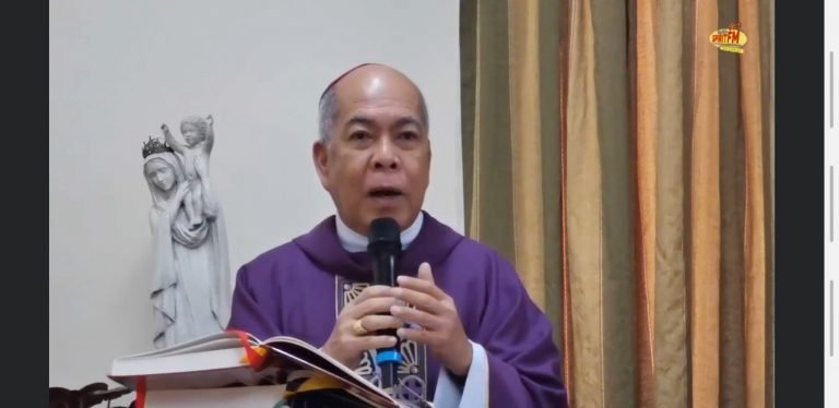 Archbishop Valles holds mass inside an empty  room