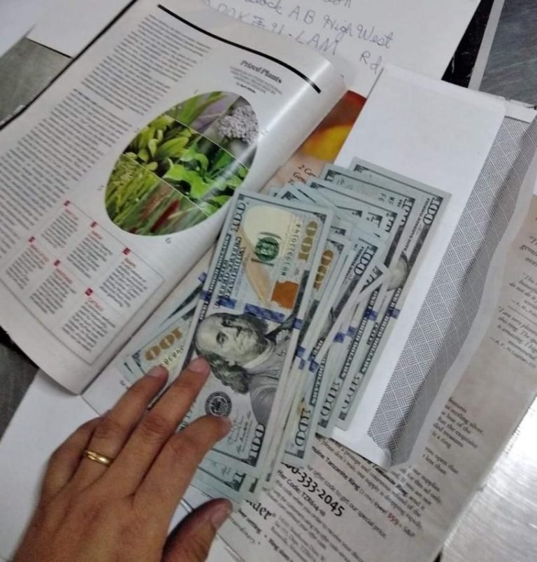 Customs  confiscates $54,215 US dollar bills inserted on pages of various magazines