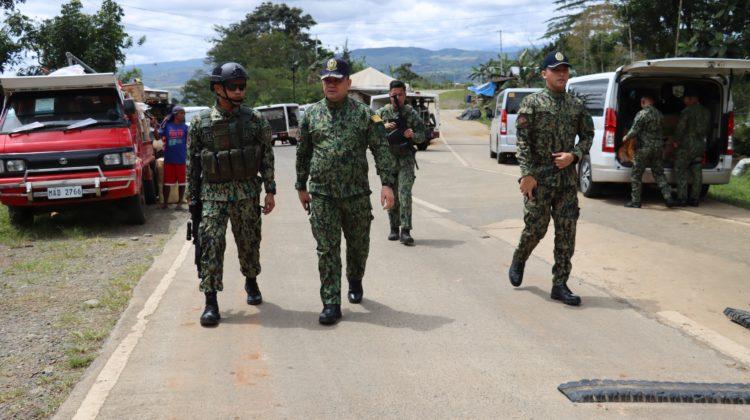 Region 10 director Police Bgen. Lawrence Coop (Center) inspect a checkpoint in Bukidnon. (photo courtesy of PBGEn Lawrence Coop)