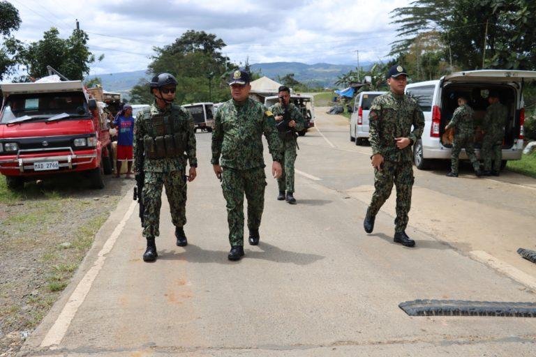 Region 10 director Police Bgen. Lawrence Coop (Center) inspect a checkpoint in Bukidnon. (photo courtesy of PBGEn Lawrence Coop)