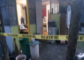 A man shot to death while drinking coffee in his house